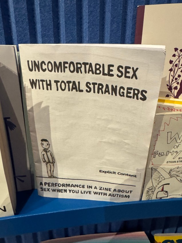 Image of Uncomfortable Sex With Total Strangers zine on a shelf at the V&A Dundee.